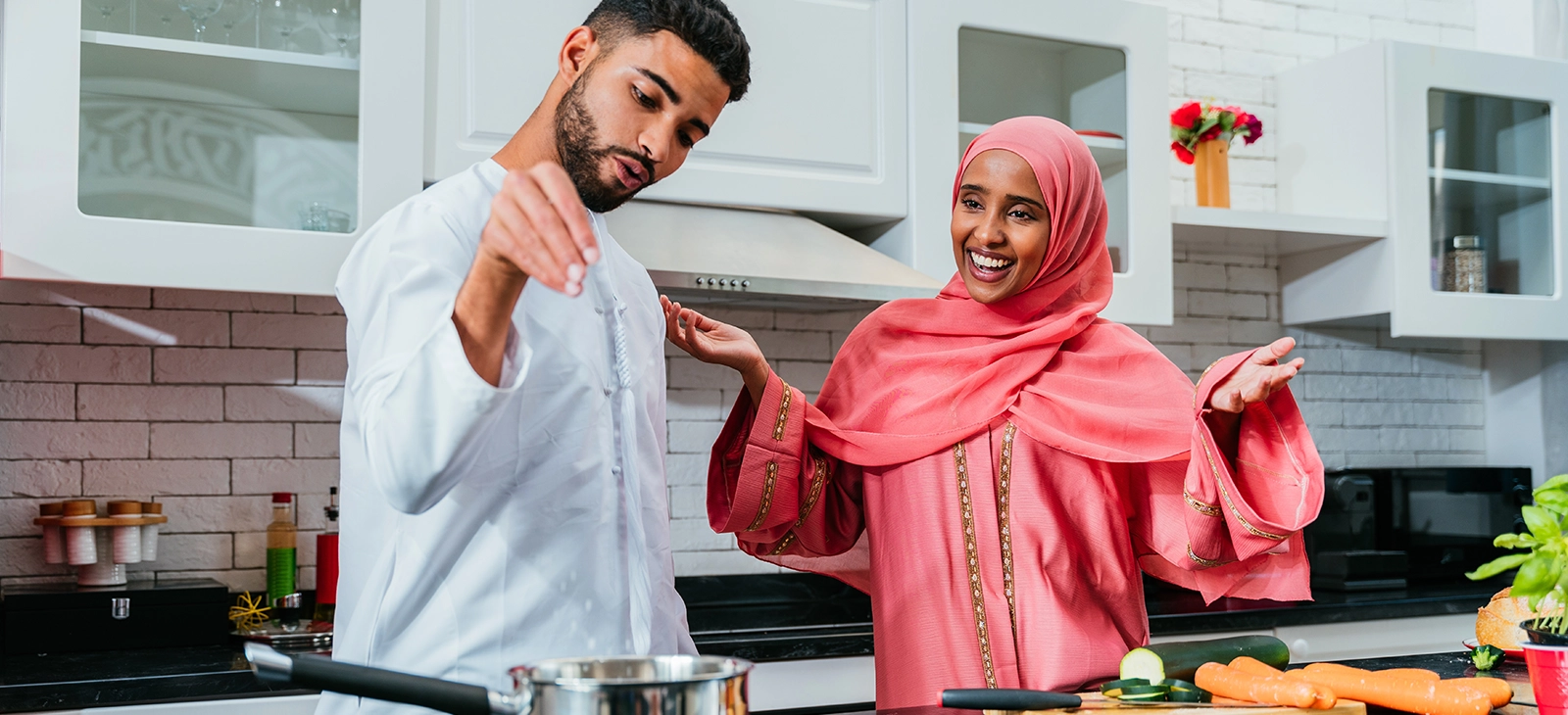 A UAE couple doing home cooking
