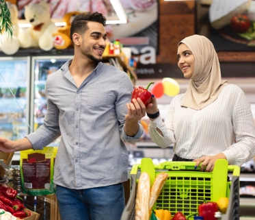 Couple doing grocery shopping in a supermarket


