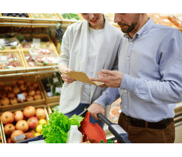 Couple discussing about which snacks to buy from list
