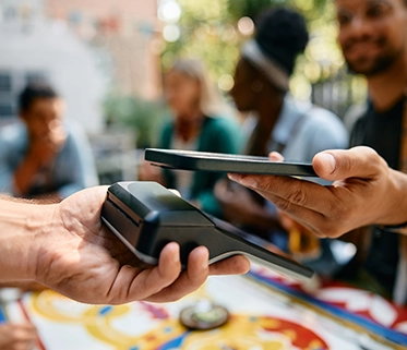 Person using phone for cashless payment
