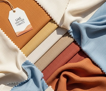 A variety of lightweight fabrics in different colors, suitable for hot weather

